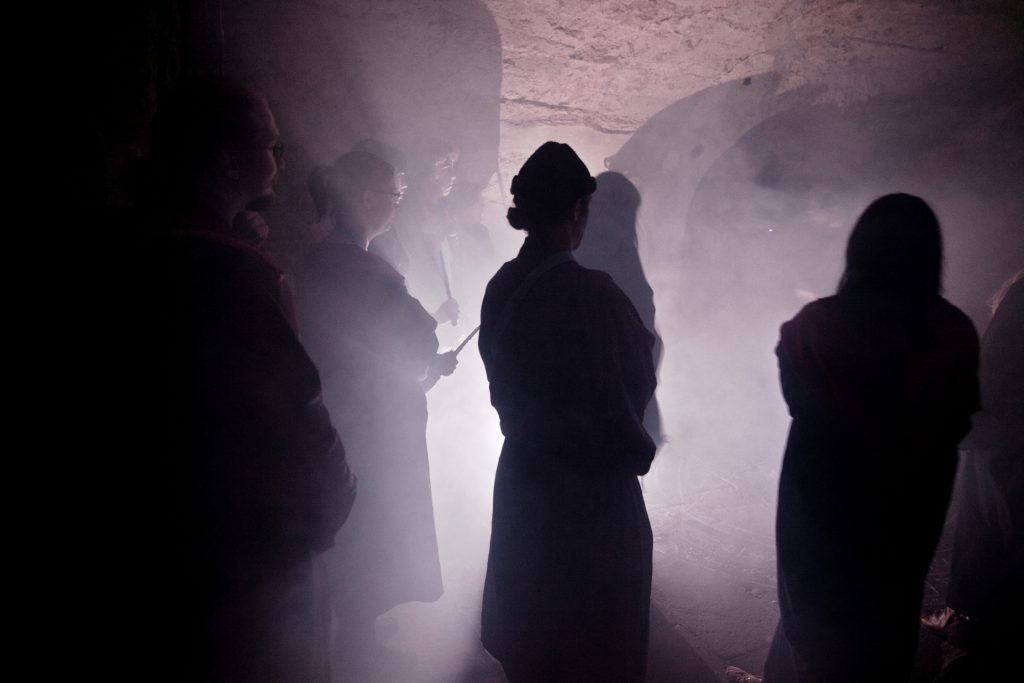 A summoning ritual in the basement. Photo by Natalia Kaniak.