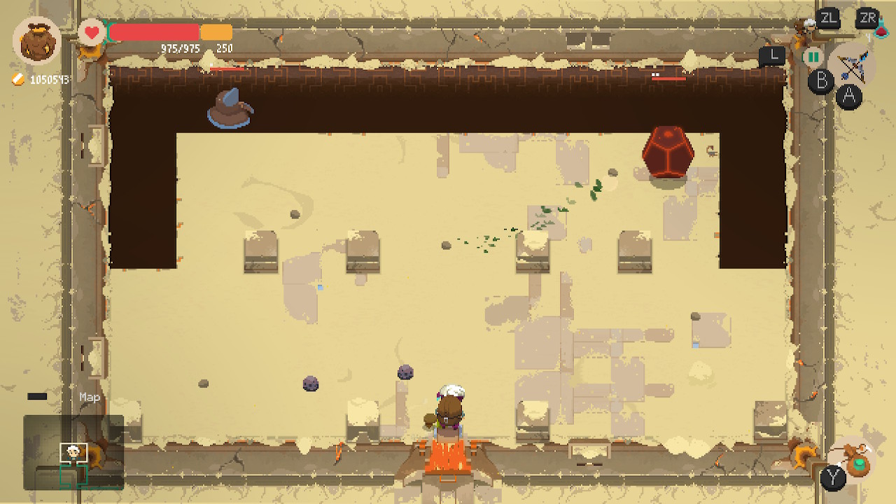 The main character Will from a bird perspective in a desert styled dungeon. A spherical enemy is in the upper right corner and a flying muppet on the left.