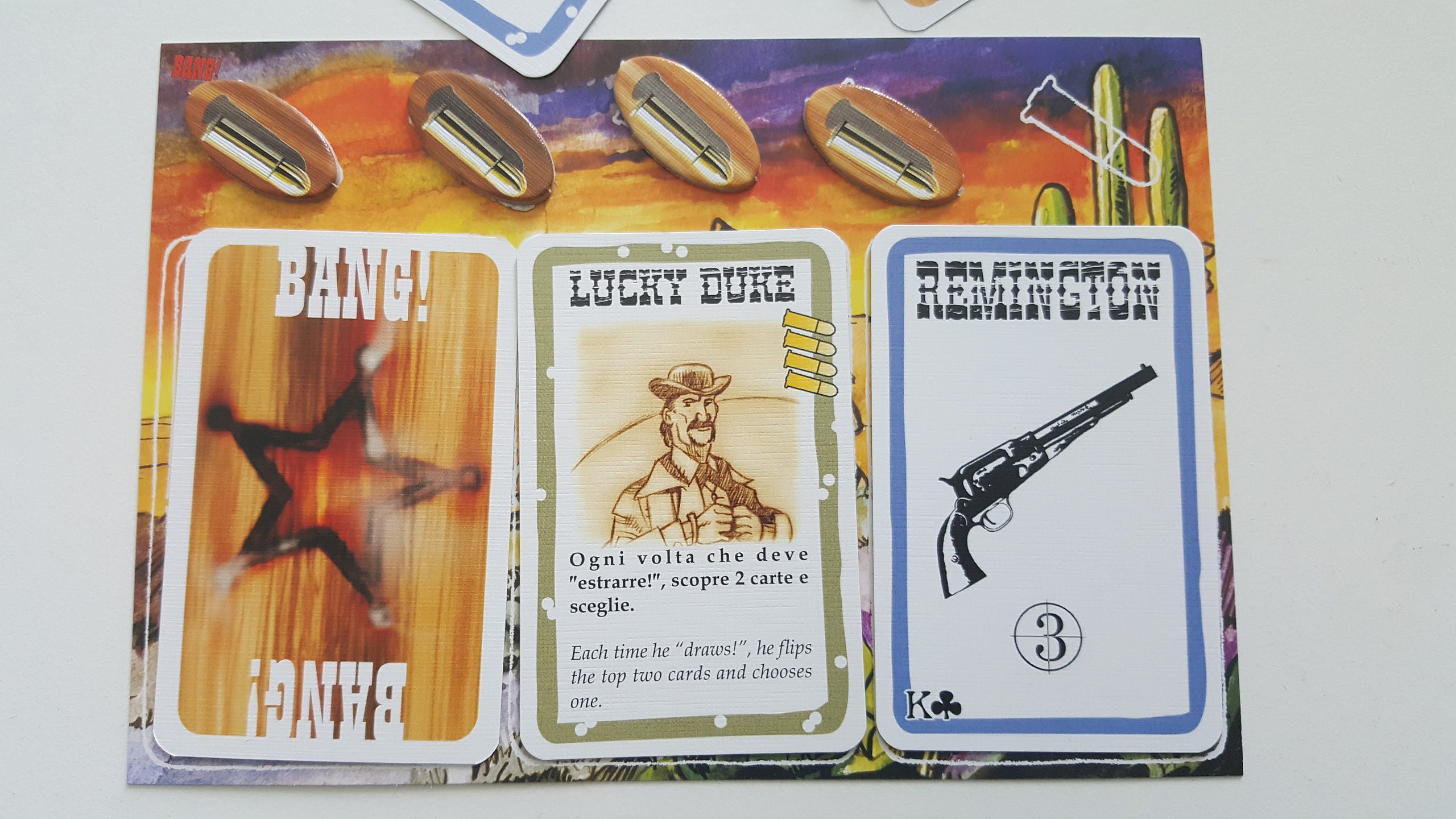 A player's role card, character card, weapon card and health (bullets)