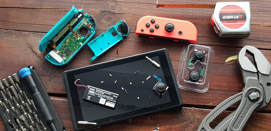 Decorative tools and disassembled Nintendo Switch controller