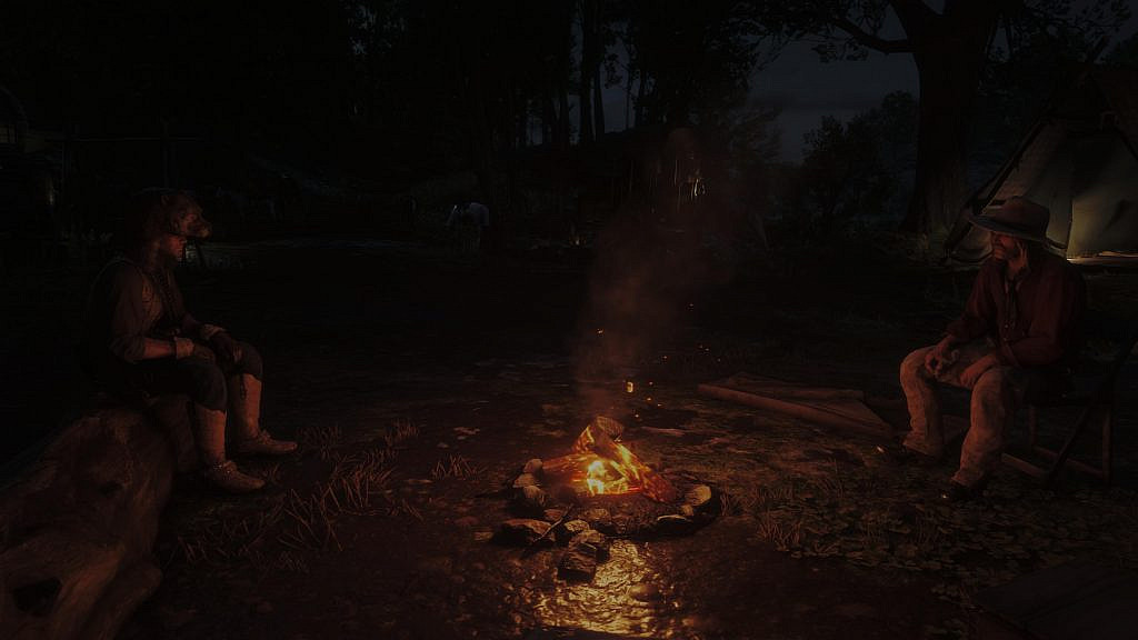 Two male characters sitting by the fire. 