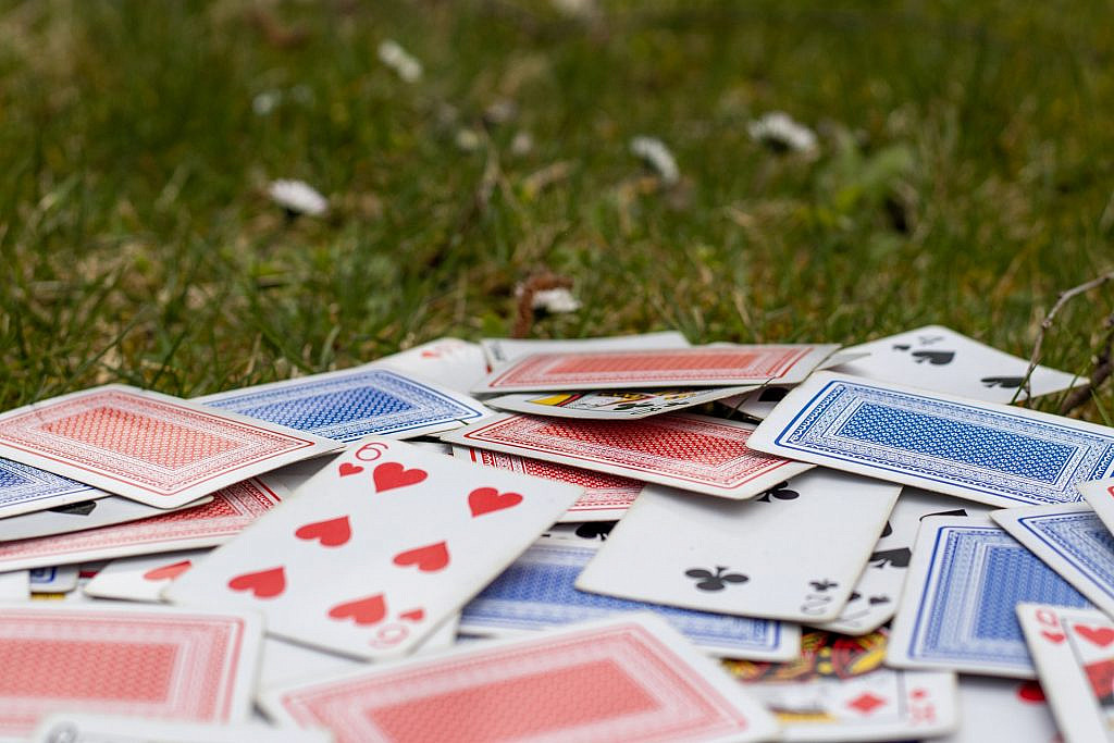 Playing cards on a field
