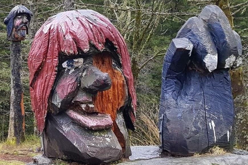 Two troll statues outside in a forest in Bergen, Norway. Photo by Usva Friman.