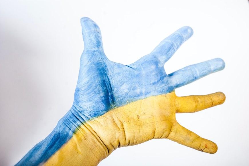 open hand painted in yellow and blue