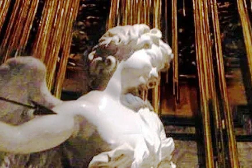Upper part of a sculpture of an angel holding a spear