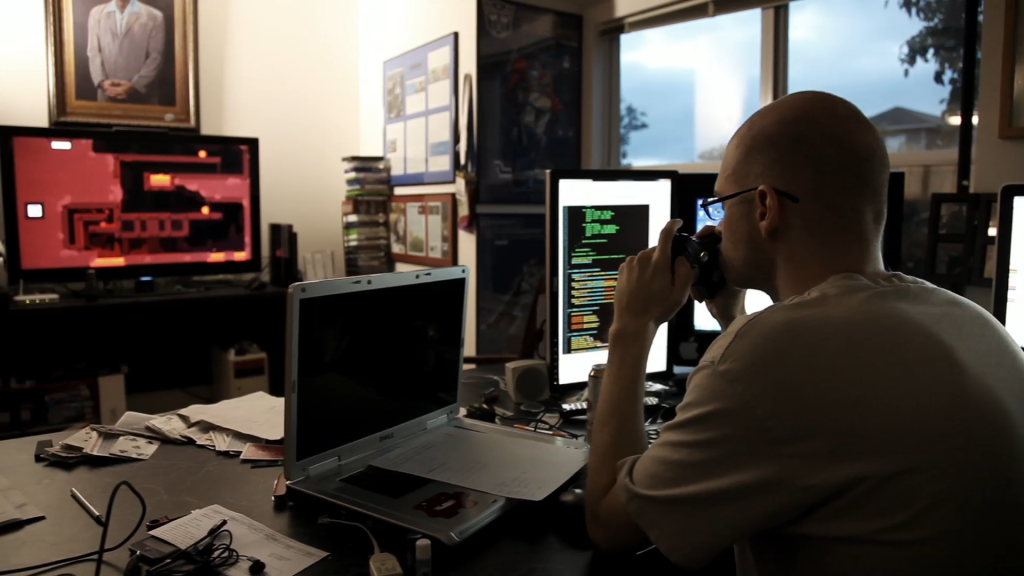 Tommy Refenes, independent developer, seen here working on Super Meat Boy. Screencap from Indie Game: The Movie (2012)