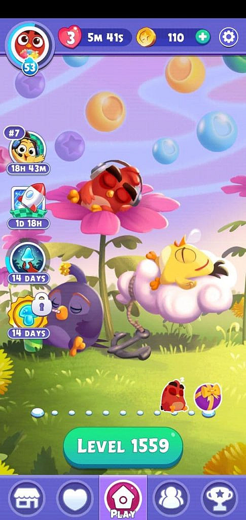 Main menu screen. Angry Birds sleeping on flowers, clouds, and grass.