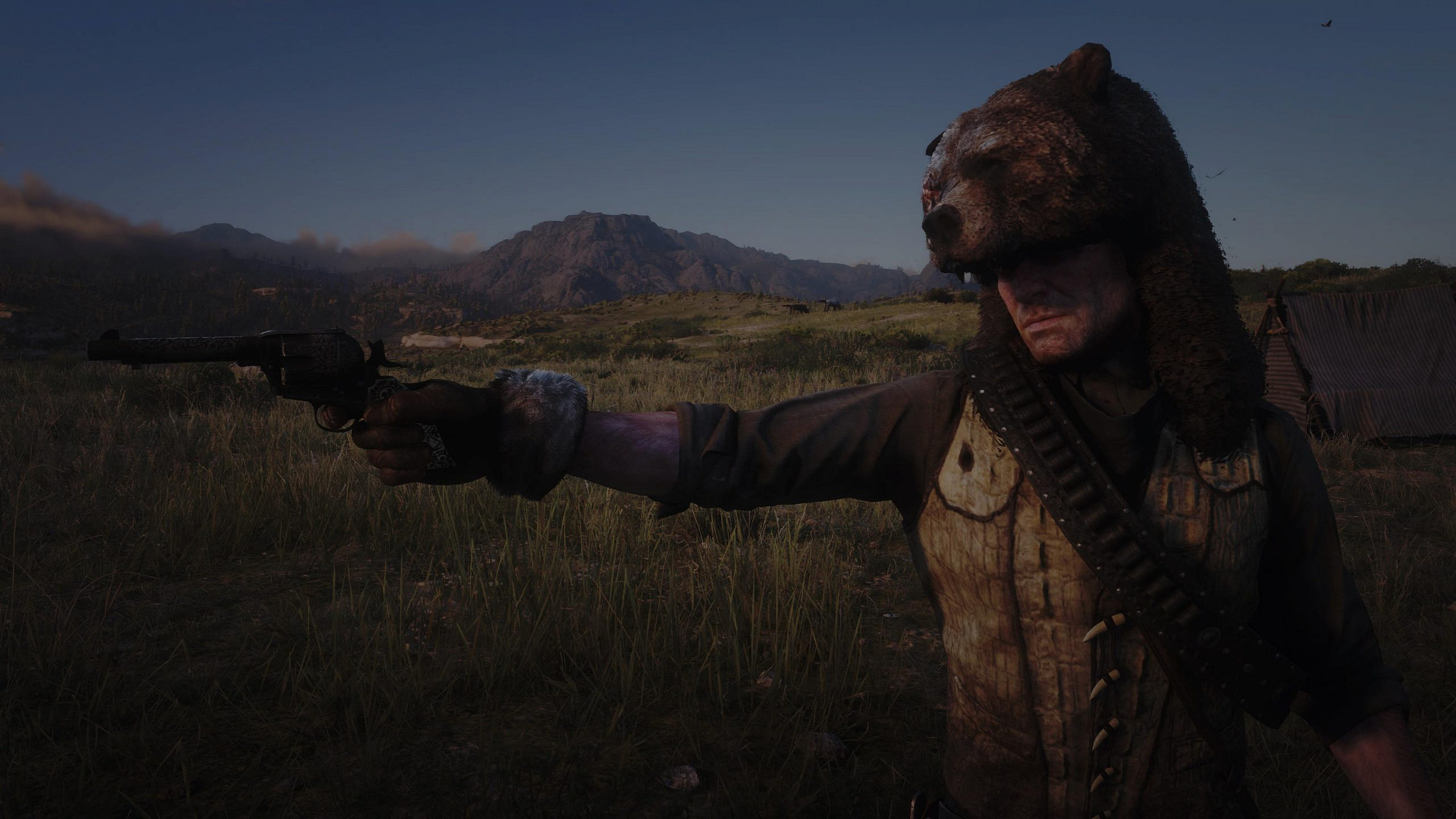 A male main character holding a revolver in front of a mountain and the darkling sky.