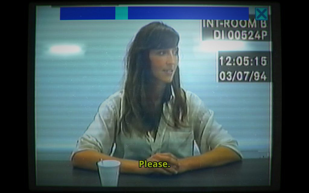 A recording of a woman being interrogated