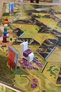 single white llama on board with standing on purple village with a purple block in back
