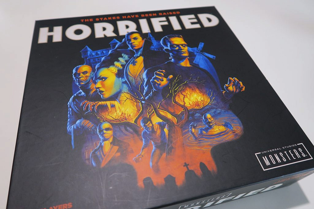 Cover of the Horrified- board game with all the monsters on it.
