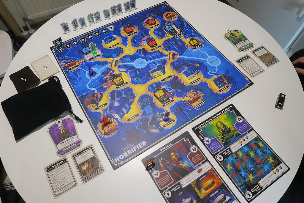 The whole board and all the pieces during play laid on a table.