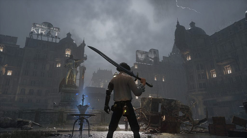 White-shirted man standing in the middle of a desolate city plaza with dilapidated buildings and wagons in sight. On top of a tall building a massive sign says "Welcome to Krat".