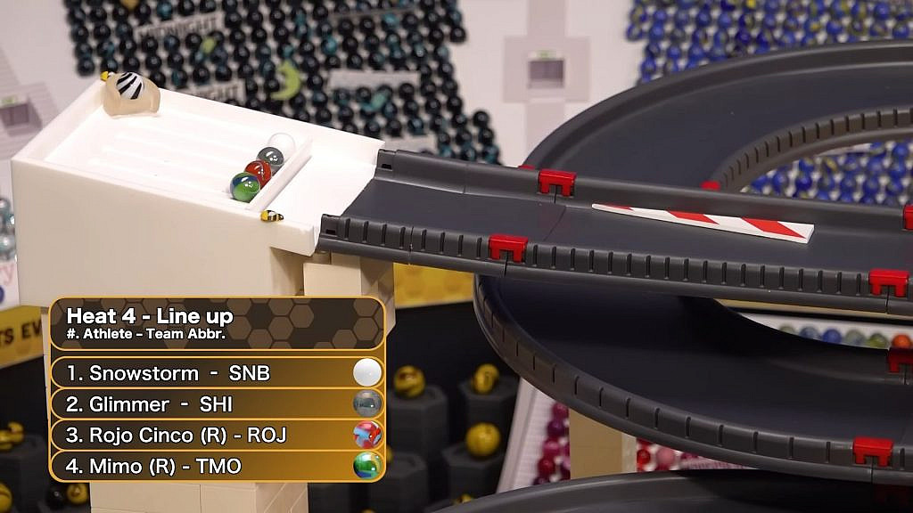 four marbles on the starting line