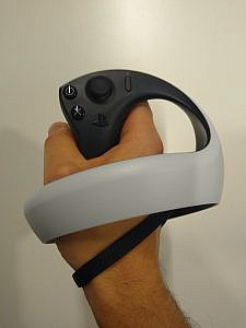 someone holding a controller in black and white