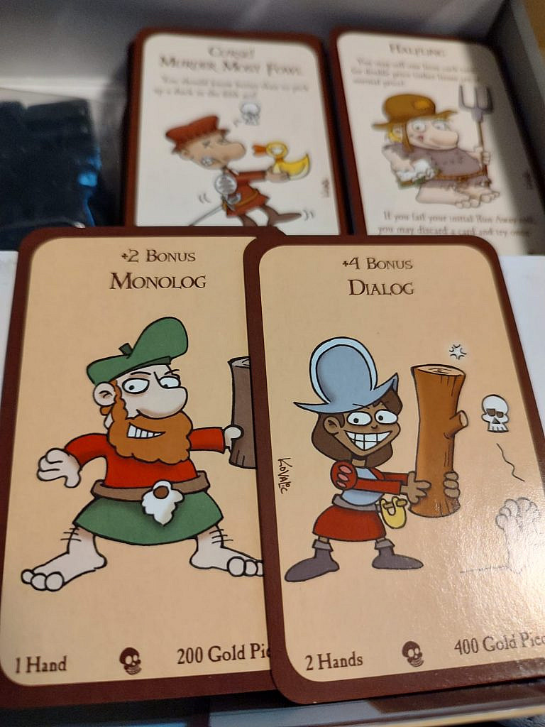 Wordplay: Monolog and Dialog: Log weapons of the game held by some quirky characters in the card art.