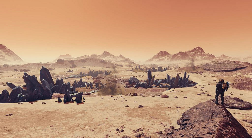 Player character looking over a scene of sandy hilltops and big purple crystals jutting from the ground.