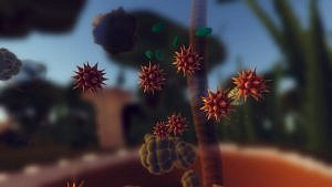 Zoomed in stylized molecules and tiny specs of matter, including spiky reddish balls and little green disks. The background is very blurry but seems to depict grass and other vegetation with a blue sky. 