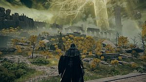 the player character in a black robe looking towards a golden tree and misty ruins