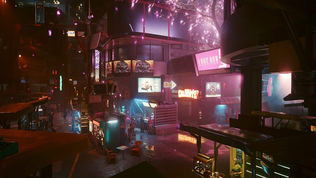 Street-food stalls, populated streets and adult entertainment advertisements on ad-boards. A holographic cherry blossom tree on the right hand side.