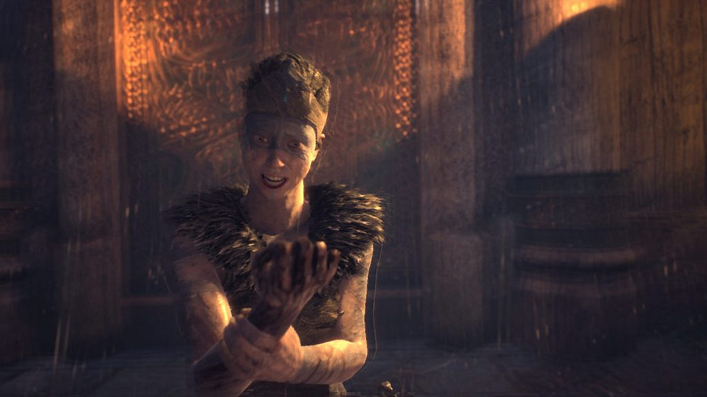 Woman holding her right hand in despair while it turns black.