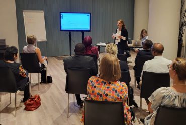 The writer having her presentation in a conference.